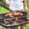A person is using a Clatronic electric grill lighter to ignite charcoal on a grill. Produktbild-Vorschau
