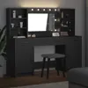 A black vanity table with a mirror and LED lights, along with a stool, is shown in a room. Náhled obrázku produktu