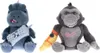 Two plush toys, a dinosaur and a gorilla, are sitting side-by-side against a white background. Náhľad obrázku produktu