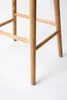 Close-up of the wooden legs and support beams of a bar stool. Produktbild-Vorschau