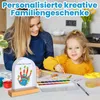 A mother and daughter are painting and creating a handprint artwork. Produktbild-Vorschau