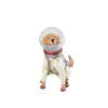 A toy dog in a spacesuit, sitting and looking forward. Produktbild-Vorschau