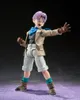 A Dragon Ball GT S.H. Figuarts Actionfigur Trunks 12 cm figure is posed against a dark background with a purple textured surface. Voir les images du produit