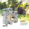 A close-up of a lawn mower carburetor is shown in the foreground, with a lawn mower in action in the background. Náhled obrázku produktu