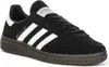 A black Adidas Handball Spezial J sneaker with white stripes and accents, shown from a side angle on a white background. Voir les images du produit