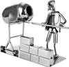 A metal figurine of a construction worker with a cement mixer and bricks. Náhľad obrázku produktu
