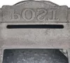 A close-up view of a rustic, vintage-style metal mailbox. Podgląd zdjęcia produktu