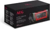 A black box with a red and black battery charger on it. Produktbild-Vorschau