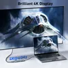 A laptop connected to a large monitor via a USB-C hub, displaying the same futuristic spaceship image on both screens. Produktbild-Vorschau