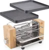 A raclette grill with two interchangeable grill plates shown in an exploded view, with the grill body in the foreground and the plates above. Produktbild-Vorschau