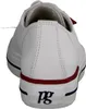 The back view of a white leather sneaker with red and navy accents. Produktbild-Vorschau