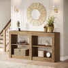 A console table with decorative items in a hallway with a staircase. Produktbild-Vorschau