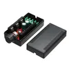 A black electronic device with a knob and green terminal blocks, shown with its cover removed and placed next to it. Produktbild-Vorschau