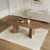A dining room scene with an oval wooden table on a rug in front of a sideboard. Náhľad obrázku produktu