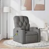 A massage chair is placed on a rug in a room with artwork on the wall and a floor lamp. Produktbild-Vorschau