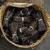 A basket filled with dried vanilla beans. Produktbild-Vorschau