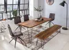 A dining room scene with a wooden table, chairs, and bench, set against a large window with a city view. Produktbild-Vorschau