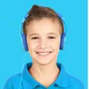 A young boy wearing blue headphones and a blue shirt, smiling at the camera against a blue background. Produktbild-Vorschau