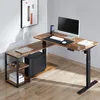 An L-shaped standing desk with a rustic brown finish and black metal legs, set up in a home office environment with a computer, keyboard, and some books. Produktbild-Vorschau
