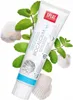 A tube of SPLAT Biocalcium toothpaste is shown with mint leaves and seashells. Produktbild-Vorschau