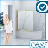 A woman in a towel stands next to a bathtub with a shower enclosure. Produktbild-Vorschau