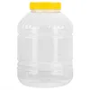A clear, studio shot of a large, empty plastic container with a yellow screw-on lid. Podgląd zdjęcia produktu