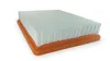 A white air filter with an orange base rests on a white surface. Voir les images du produit