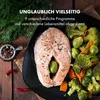 A close-up of a cooked salmon steak with steamed vegetables, presented on a black plate, with text overlays describing product features. Produktbild-Vorschau