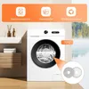A washing machine with cleaning pads shown in a bathroom setting, with a scenic background. Produktbild-Vorschau