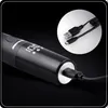 A close-up shot of a black electric nose and ear trimmer being charged via a USB-C cable. A separate inset shows the USB-A to USB-C cable. Náhled obrázku produktu