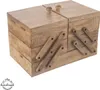 A wooden sewing box with multiple compartments and folding drawers. Anteprima dell’immagine prodotto