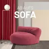 A red beanbag sofa is shown in a room with red curtains and a floor lamp. Text overlays suggest a sale or promotion. Voir les images du produit