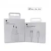 Two white Apple product boxes are shown side-by-side against a white background. The box on the left displays an image of a white USB-C power adapter and text indicating it is a '20W Power Adapter'. The box on the right shows an image of a white USB-C to L Produktbild-Vorschau