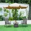 Outdoor patio set with chairs, table, and umbrella on a lawn. Produktbild-Vorschau
