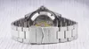 The back of a silver watch with a metal band is shown against a light-colored, textured background. Náhled obrázku produktu