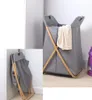 A collage showing a gray fabric laundry basket with wooden accents, both in use and folded. Náhľad obrázku produktu