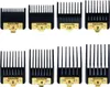 A set of eight black clipper guards with gold numbering and brand markings, arranged in two rows on a white background. Voir les images du produit