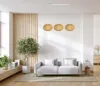 A living room scene with a sofa, plant, and pendant lights. Produktbild-Vorschau