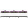 A row of three white planters filled with purple flowers and green foliage, set against a white background. Anteprima dell’immagine prodotto