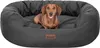 A dachshund dog is lying on a dark gray dog bed. Voir les images du produit