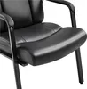 A close-up view of the seat and armrest of a black leather chair. Produktbild-Vorschau