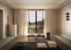 A living room with two chairs facing a large window with a view of a landscape. Produktbild-Vorschau