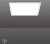 A square LED panel light is mounted on a dark gray ceiling. Produktbild-Vorschau