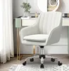 A white office chair is placed next to a vanity table with a mirror and some decorative items. Produktbild-Vorschau