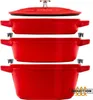 A stack of three red cast iron pots with a lid on top, set against a white background. Produktbild-Vorschau
