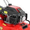 Close-up view of the engine of a red lawnmower. Produktbild-Vorschau