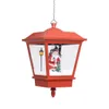 A red Christmas lantern with a Santa Claus figurine inside, suspended by a chain. Náhľad obrázku produktu