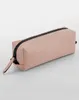A pink accessory case with a black zipper is shown against a plain background. Voir les images du produit