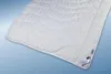 A white duvet with a wavy quilted pattern is shown diagonally on a light blue background. Produktbild-Vorschau