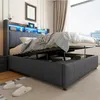 A modern upholstered bed with storage and LED lighting in a bedroom setting. Anteprima dell’immagine prodotto